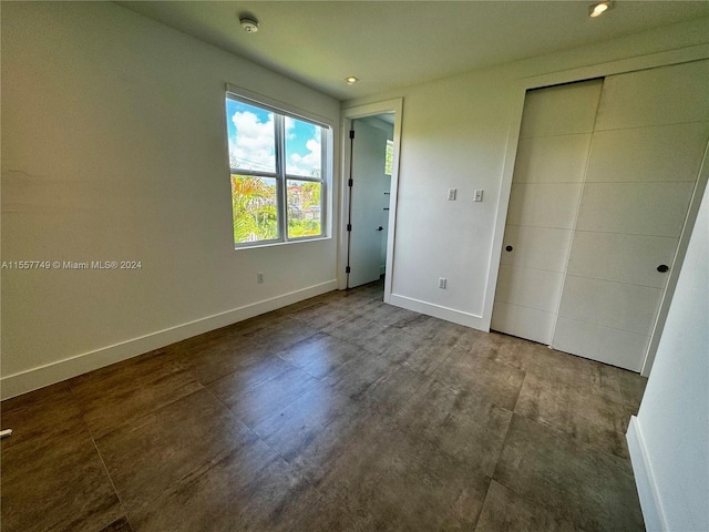 unfurnished bedroom with a closet