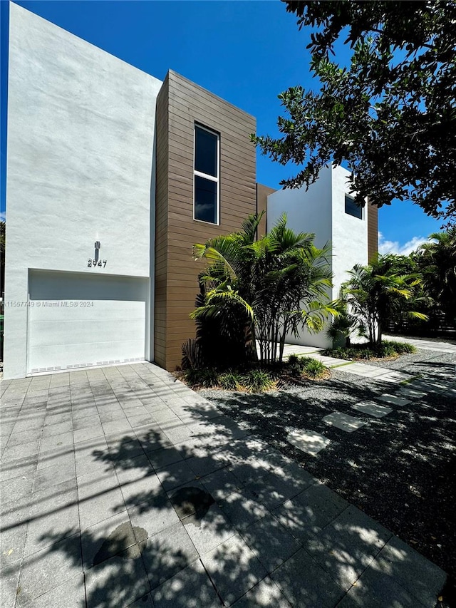 view of side of property featuring a garage