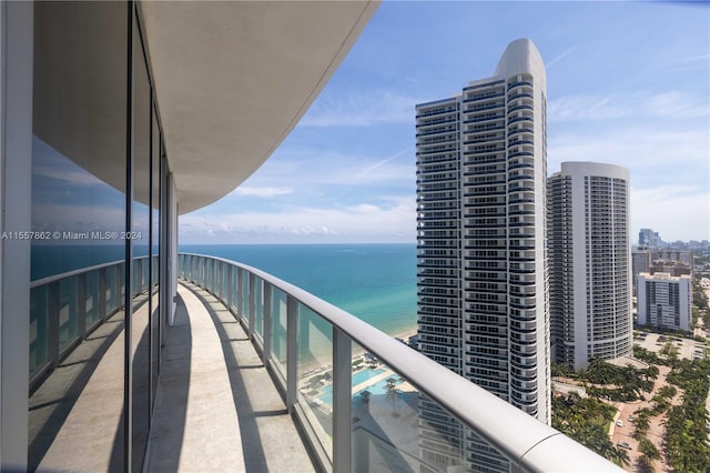 balcony featuring a water view