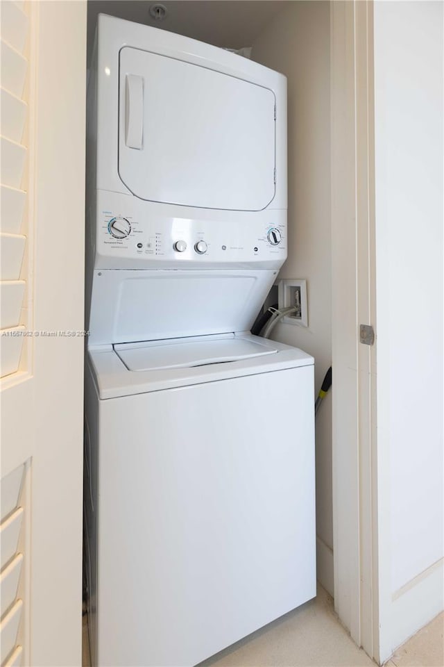 washroom featuring hookup for a washing machine and stacked washer and dryer