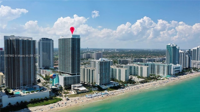 property's view of city featuring a beach view and a water view