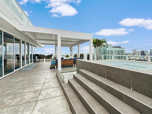 view of patio / terrace with an outdoor living space and a balcony