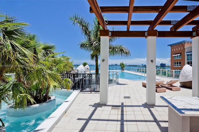 view of patio with a pergola and a community pool