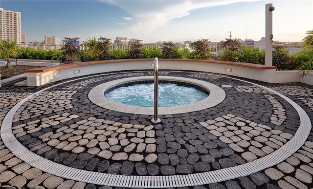 view of pool featuring a community hot tub