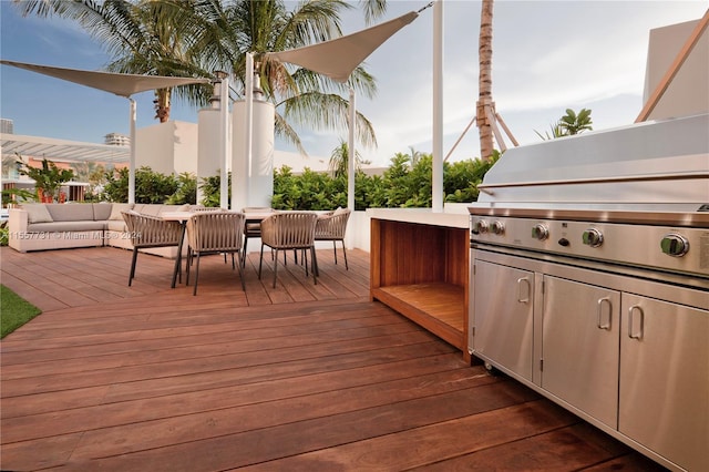 wooden terrace with an outdoor hangout area