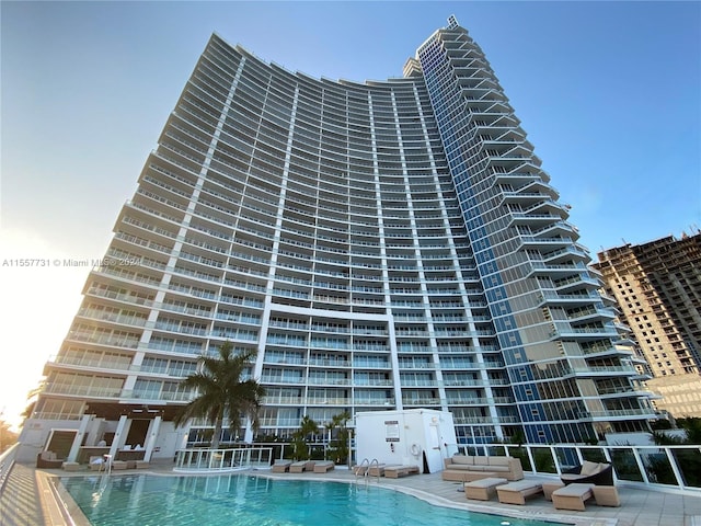 view of property featuring a community pool