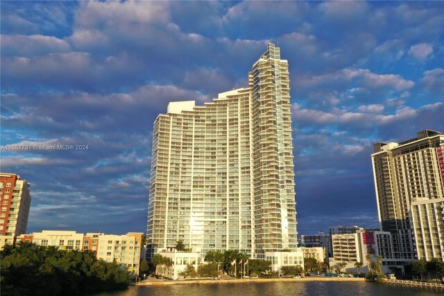 view of building exterior with a water view