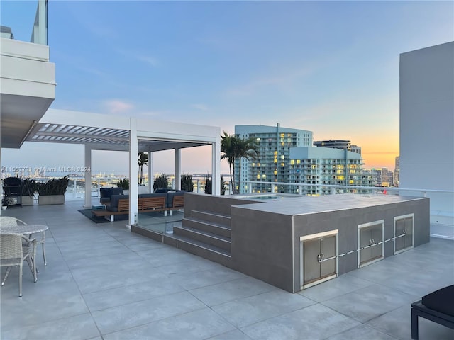 patio terrace at dusk with an outdoor living space