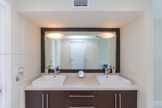 bathroom featuring double vanity