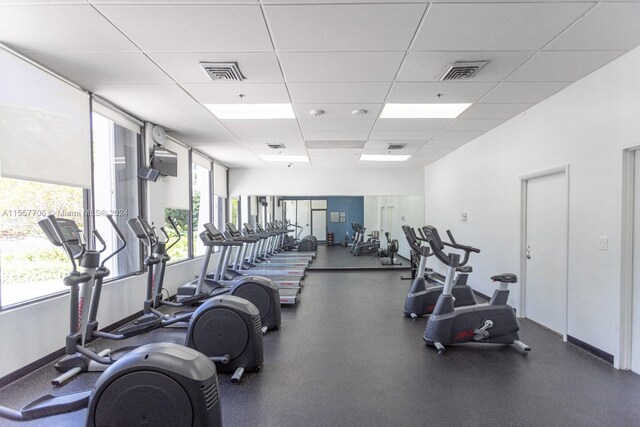 exercise room with a drop ceiling