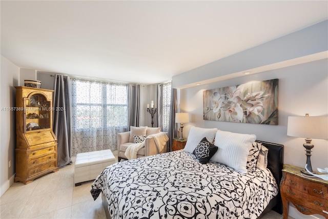 bedroom featuring light tile floors