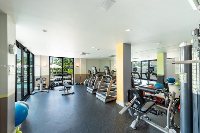 workout area with a wall of windows