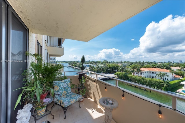 balcony featuring a water view