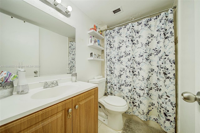 bathroom featuring oversized vanity, toilet, and tile flooring