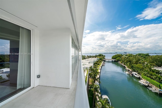 balcony featuring a water view