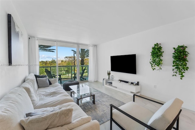 living room with expansive windows and light tile floors