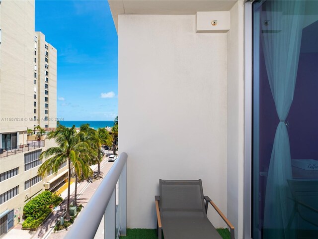 balcony featuring a water view