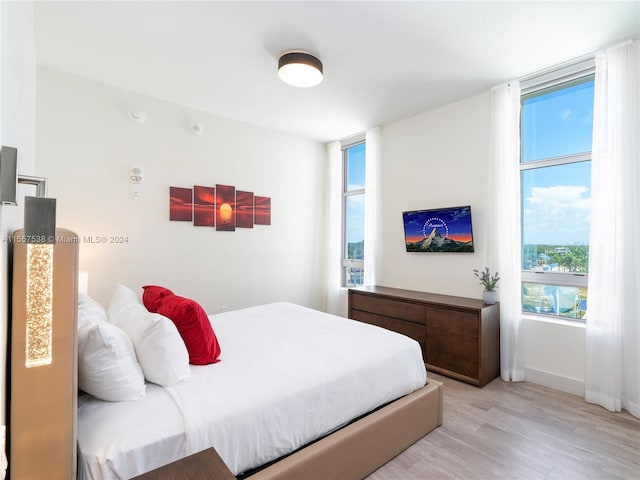 bedroom with light hardwood / wood-style floors