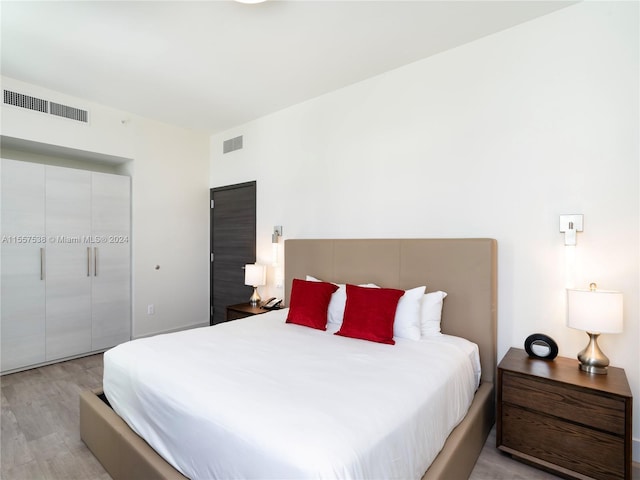 bedroom featuring light hardwood / wood-style floors