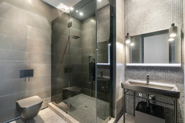 bathroom featuring a shower with door, decorative backsplash, tile walls, and toilet