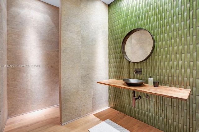 bathroom with sink and wood-type flooring