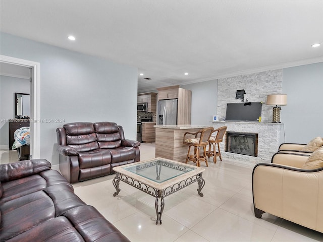 tiled living room featuring ornamental molding and a fireplace