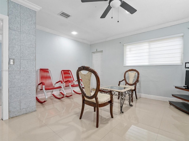 dining space featuring light tile floors, crown molding, and ceiling fan