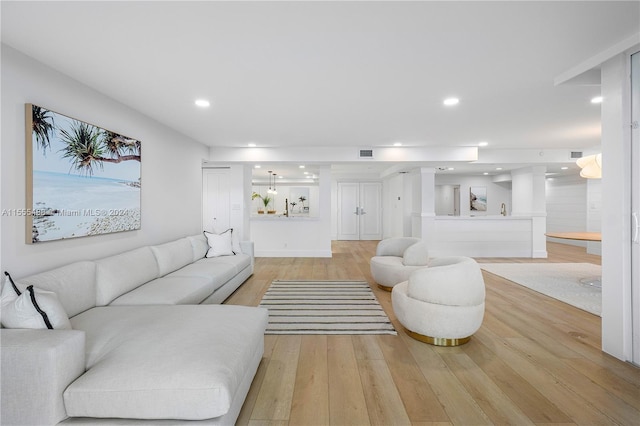 living room with light hardwood / wood-style floors