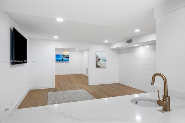 kitchen with sink and light hardwood / wood-style floors