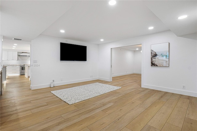 unfurnished living room with light hardwood / wood-style flooring