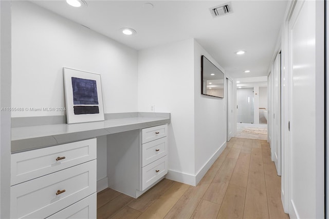 hallway featuring light hardwood / wood-style flooring