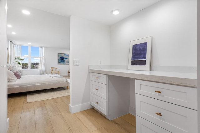 bathroom featuring hardwood / wood-style flooring and vanity