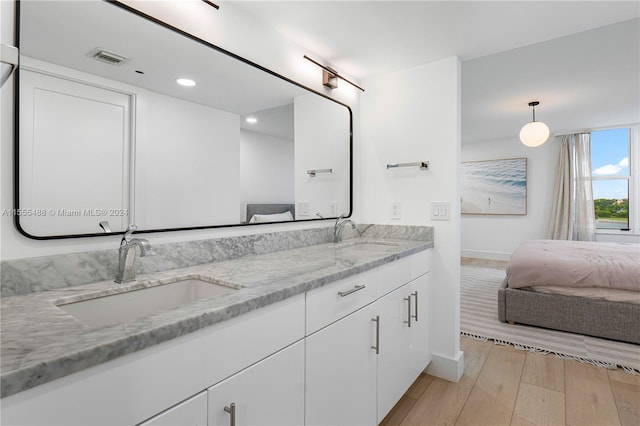 bathroom featuring vanity and hardwood / wood-style flooring