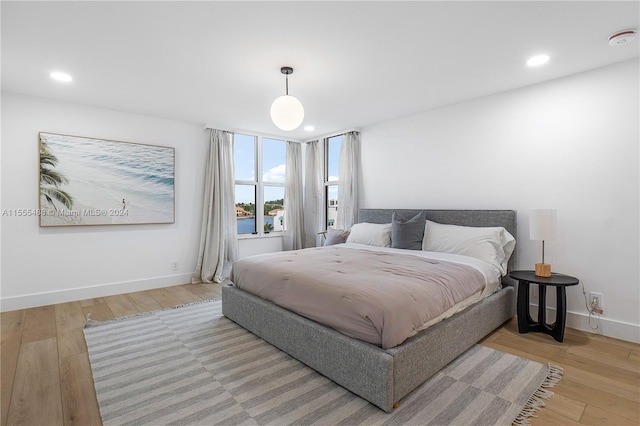 bedroom with light hardwood / wood-style flooring