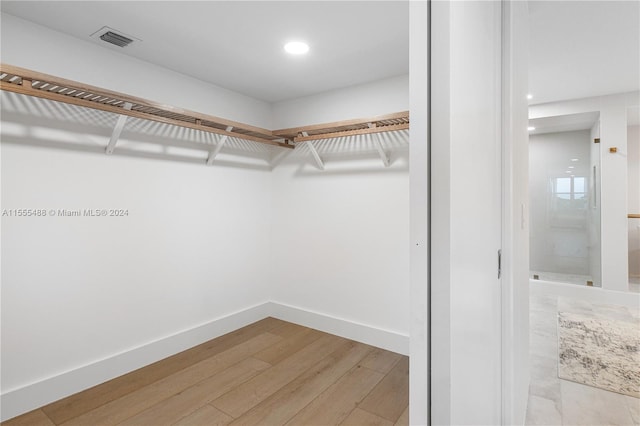 walk in closet featuring light wood-type flooring