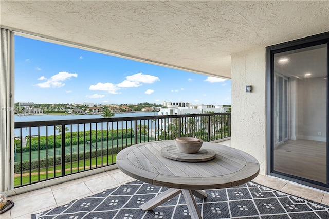 balcony featuring a water view