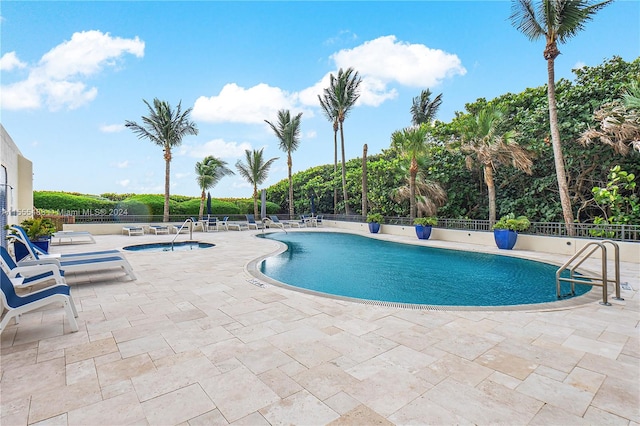 view of swimming pool with a patio area