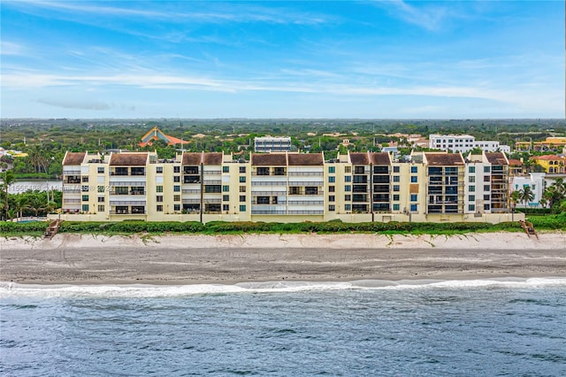 bird's eye view featuring a view of the beach and a water view