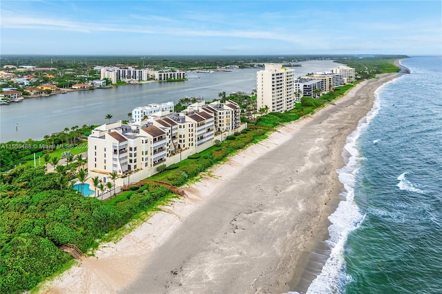 aerial view featuring a water view and a beach view