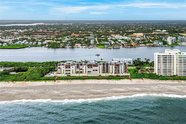 drone / aerial view with a water view and a view of the beach