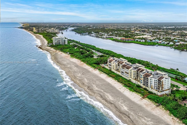 bird's eye view featuring a beach view and a water view