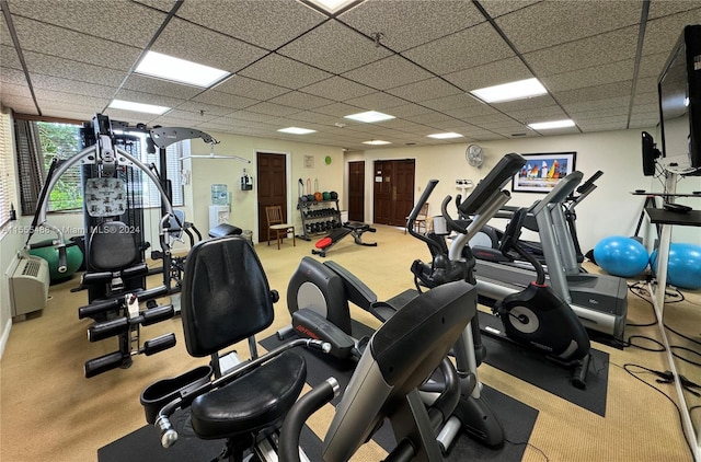 workout area featuring a drop ceiling