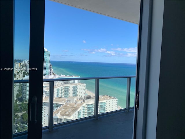 balcony featuring a water view