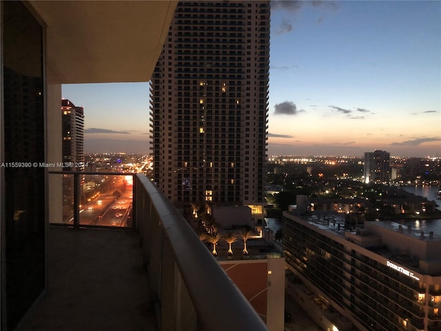 view of balcony at dusk