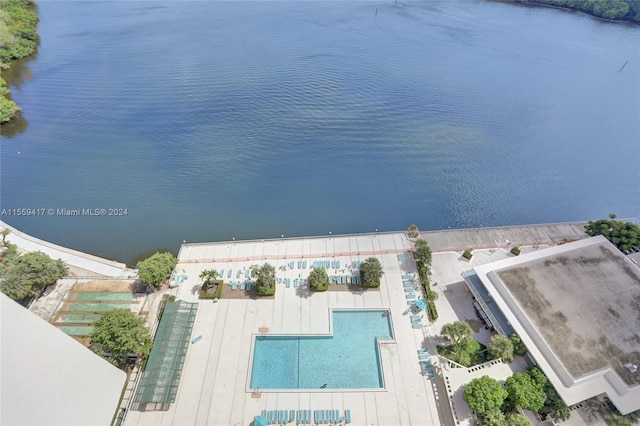 birds eye view of property with a water view