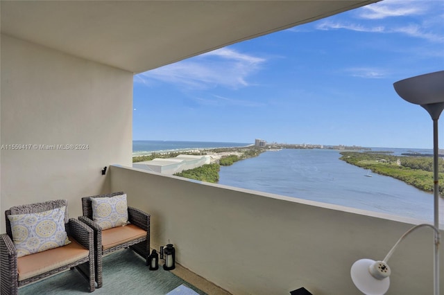 balcony featuring a water view