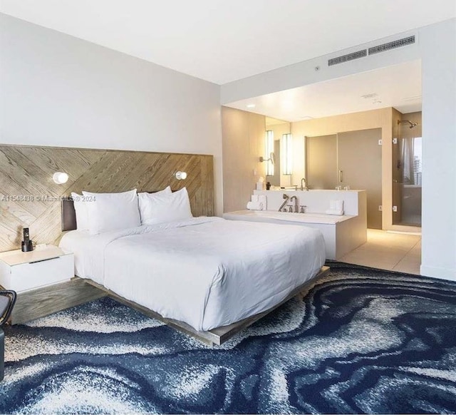 bedroom featuring light tile floors