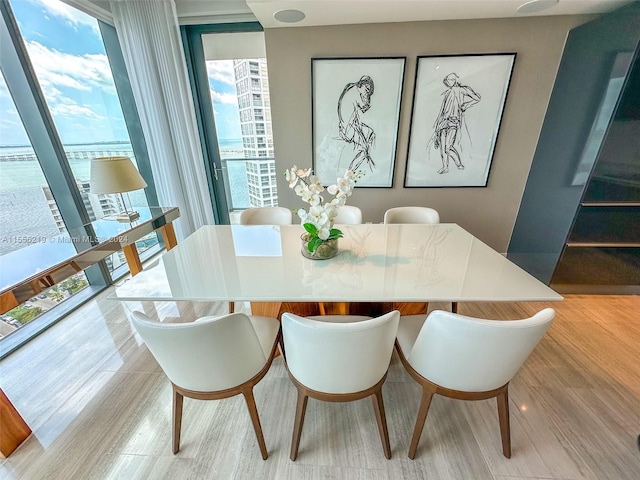 dining area featuring light wood-type flooring