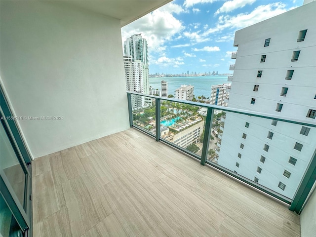 balcony featuring a water view