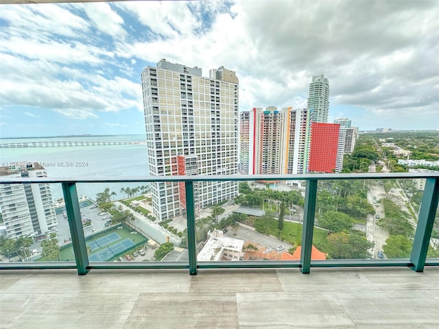 balcony featuring a water view